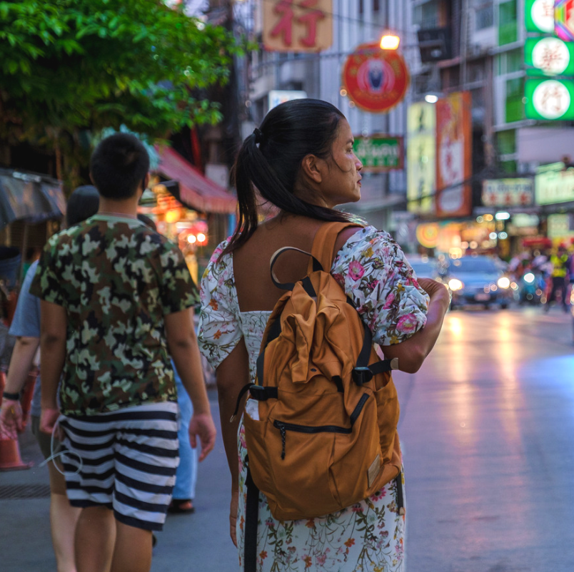 Travellers exploring a busy street in Bangkok