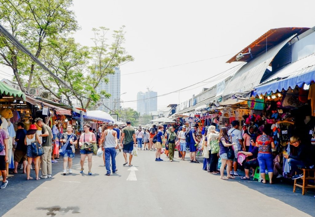 Stalls and shoppers at Chatuchak Market